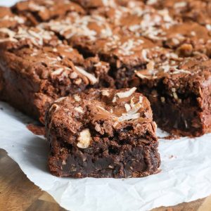 Chocolate coconut brownies topped with shredded coconut