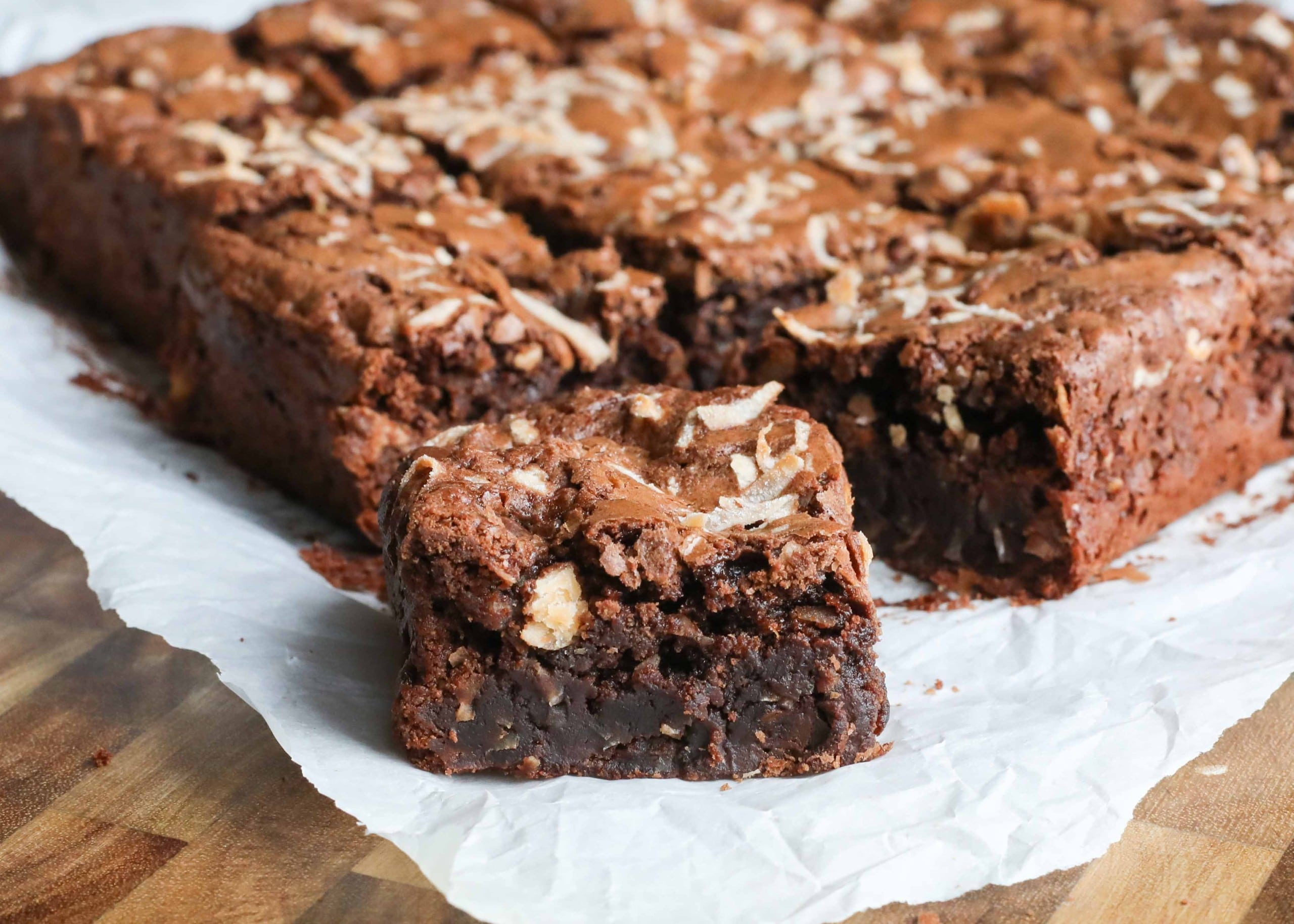 Chocolate coconut brownies topped with shredded coconut